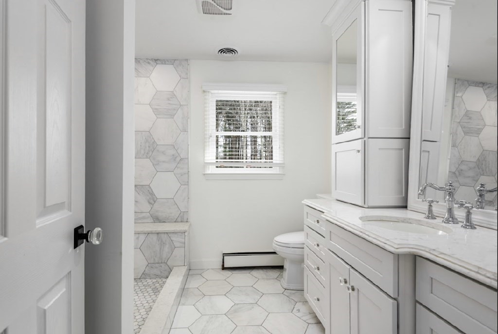 11 Woodman Road Amesbury, MA 01913 - Photo 13 of 31 a bathroom with a sink toilet and shower