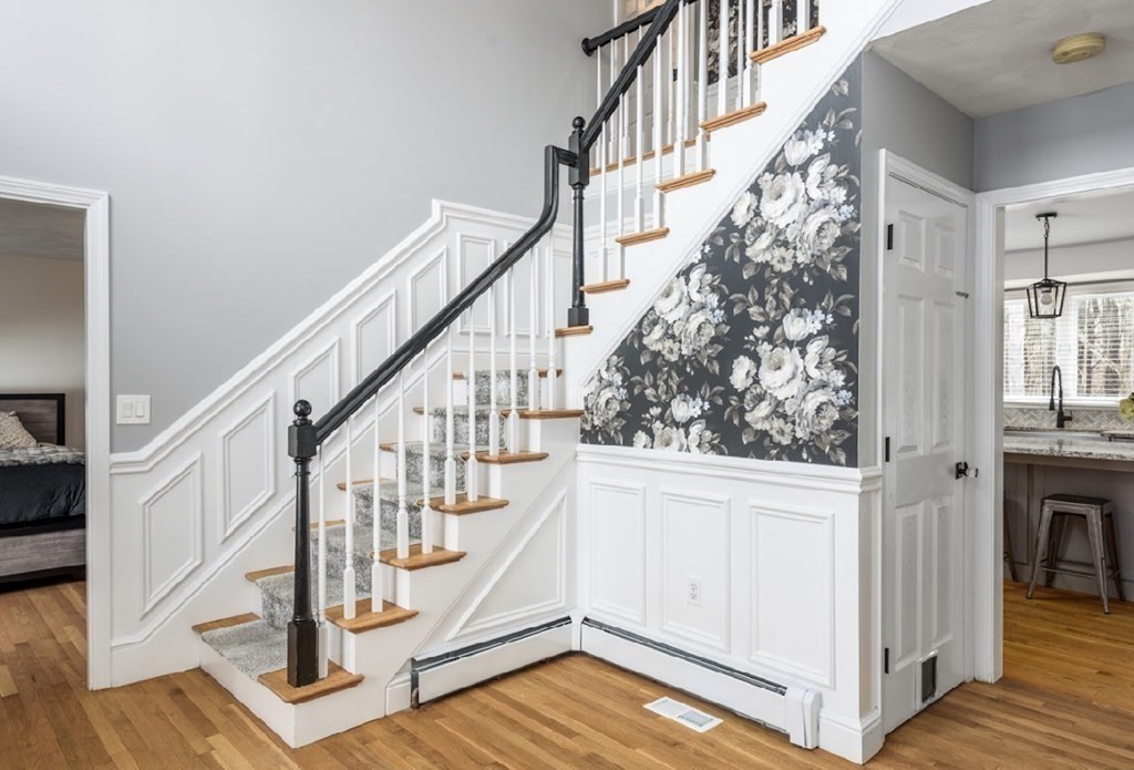 11 Woodman Road Amesbury, MA 01913 - Photo 16 of 31 a view of entryway with wooden floor and stairs