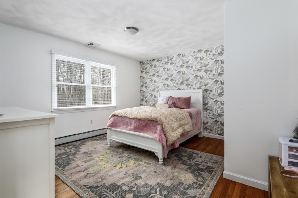 11 Woodman Road Amesbury, MA 01913 - Photo 20 of 31 a bedroom with a bed and a window
