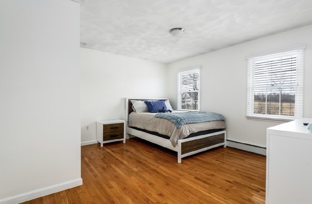 11 Woodman Road Amesbury, MA 01913 - Photo 21 of 31 a bedroom with a bed and window