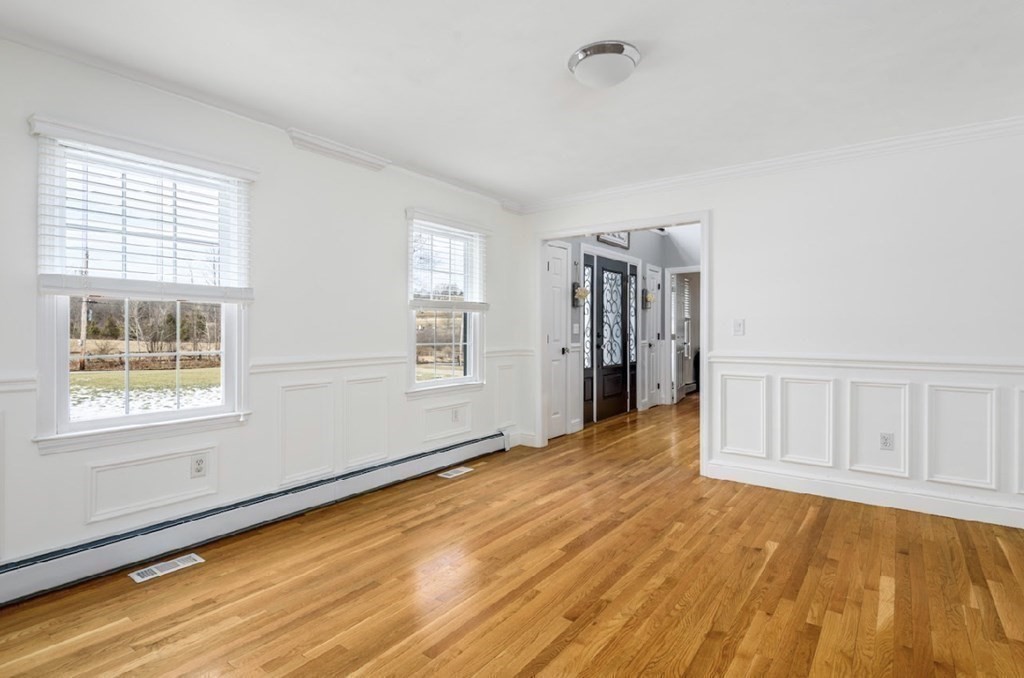 11 Woodman Road Amesbury, MA 01913 - Photo 24 of 31 a view of an empty room with wooden floor and a window