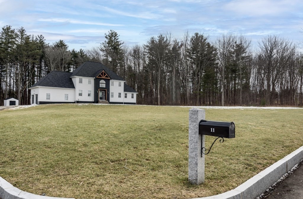 11 Woodman Road Amesbury, MA 01913 - Photo 4 of 31 a view of a yard with iron fence