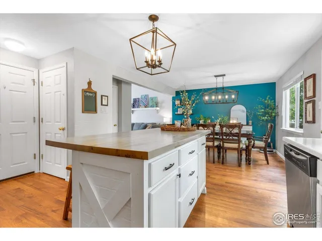a kitchen with stainless steel appliances granite countertop a stove and cabinets