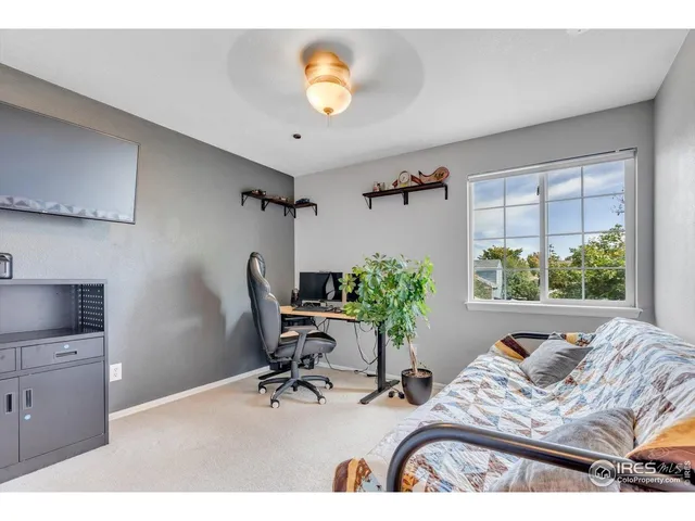 a bedroom with furniture and a window