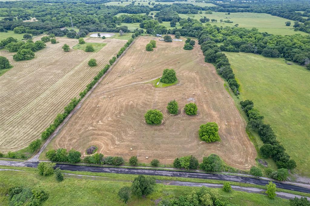 5286 County Road 4502 Commerce, TX 75428 - Photo 8 of 21 an aerial view of a house with a yard and lake view
