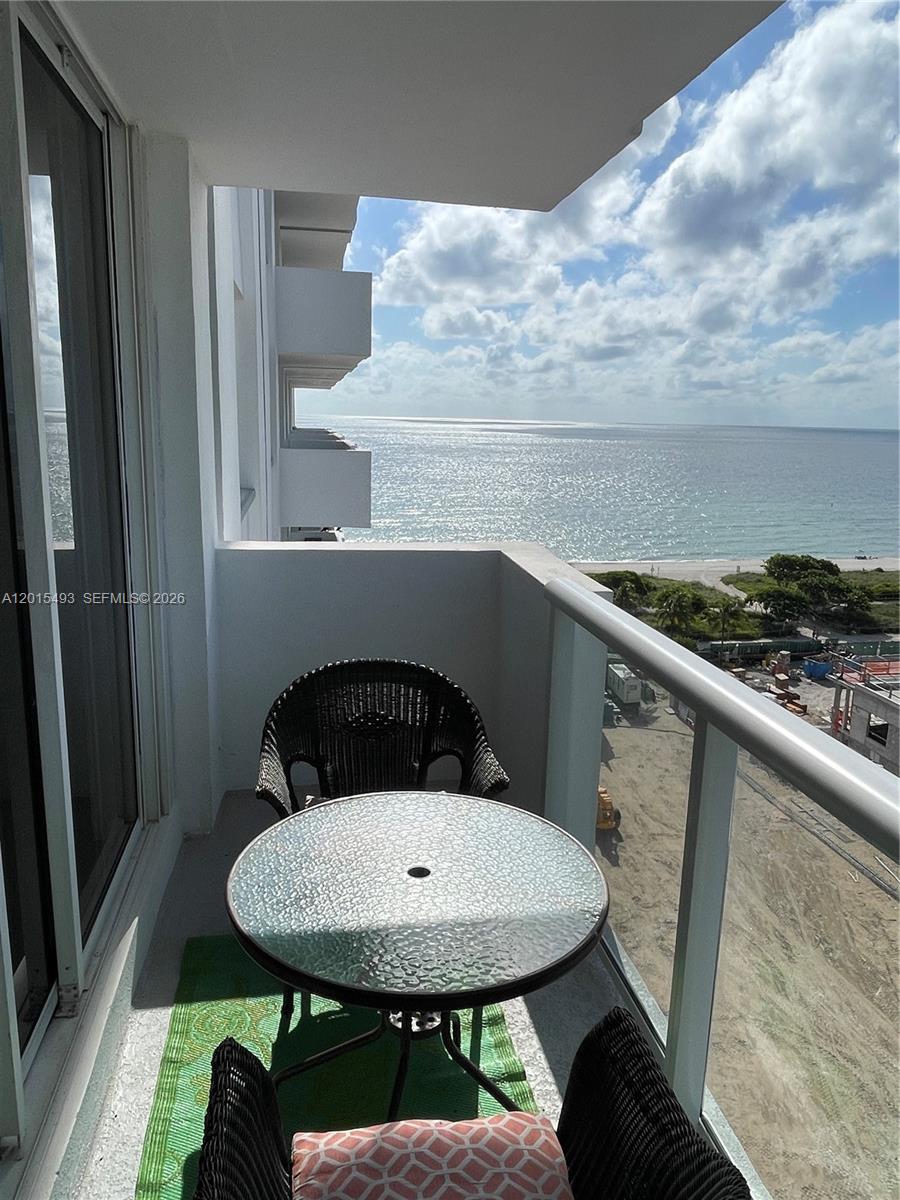 9195 Collins Avenue, Unit 1012 Surfside, FL 33154 - Photo 13 of 27 a bathroom with a toilet and a sink