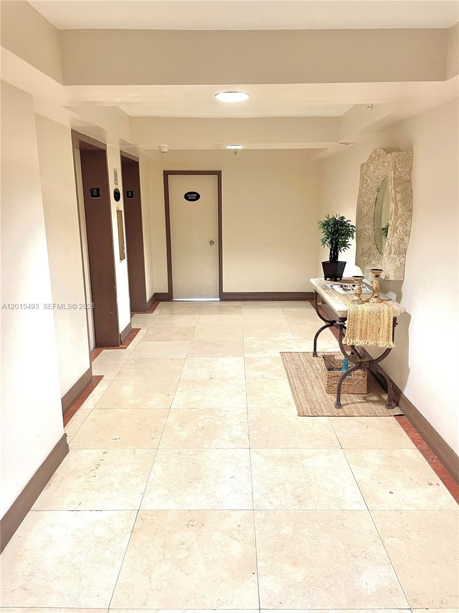9195 Collins Avenue, Unit 1012 Surfside, FL 33154 - Photo 14 of 27 a living room with furniture