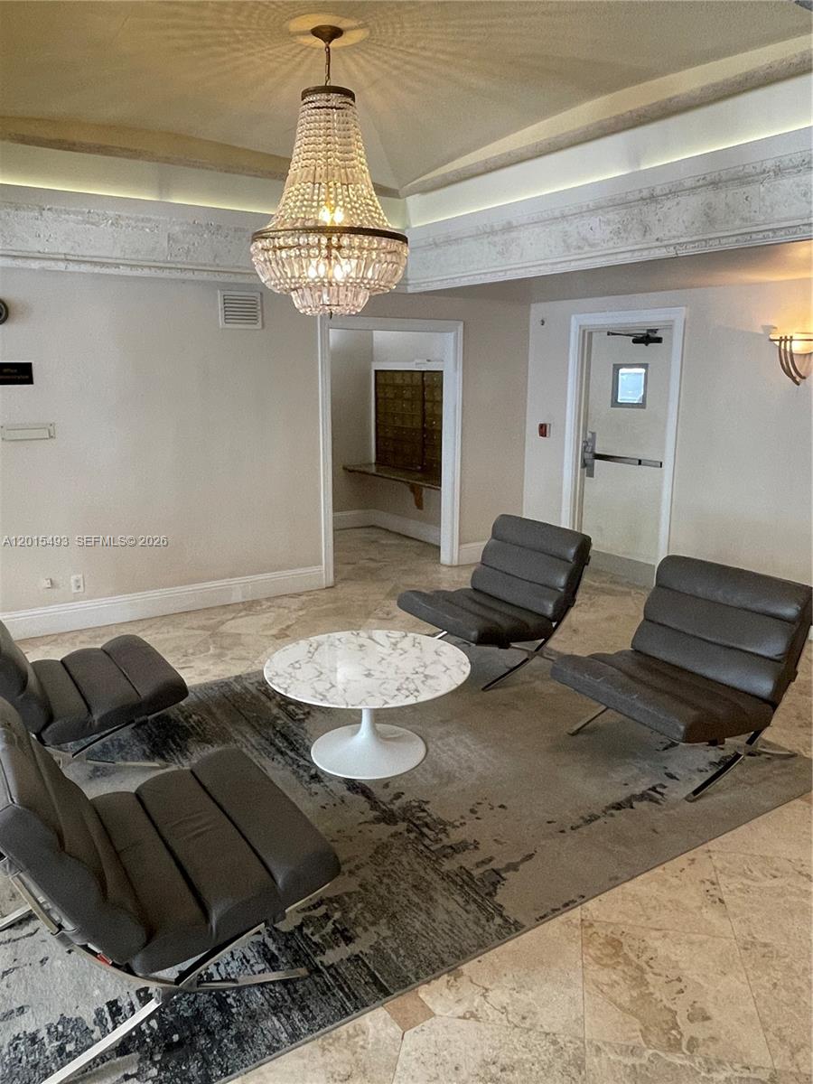 9195 Collins Avenue, Unit 1012 Surfside, FL 33154 - Photo 15 of 27 a view of a dining room with furniture