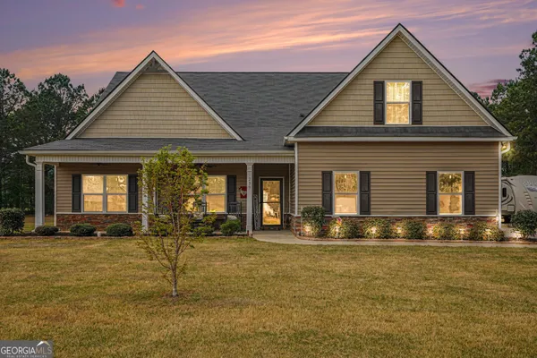 a front view of a house with a yard