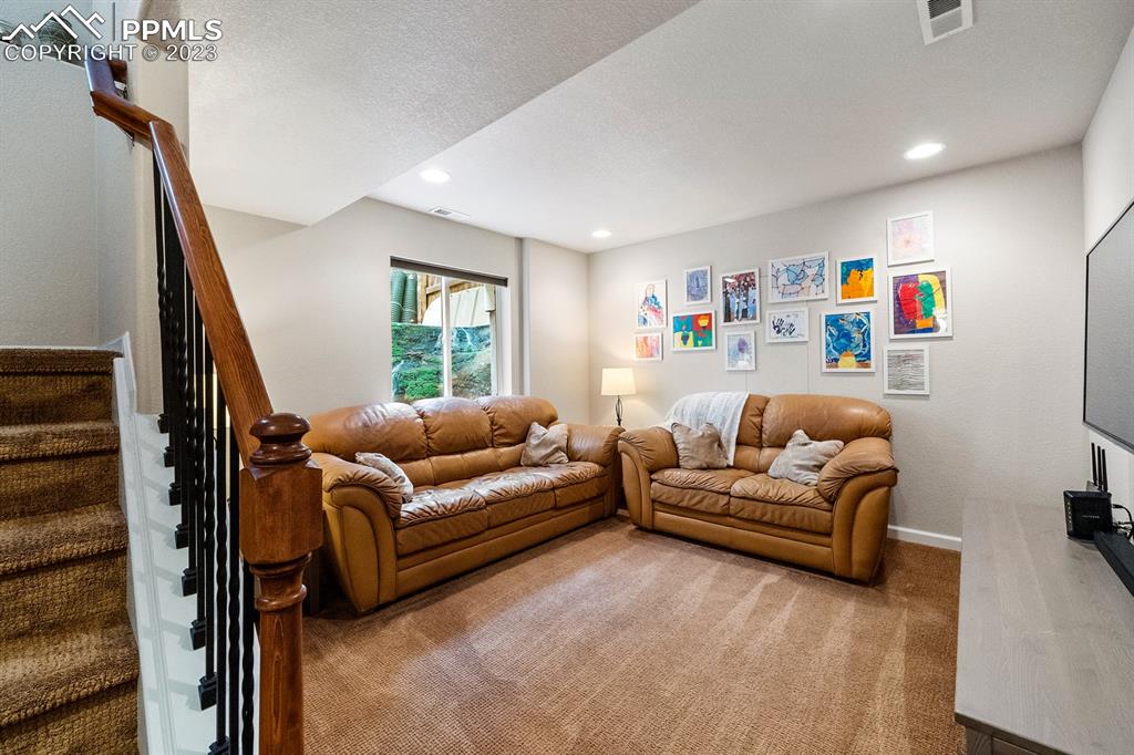 1104 Riddlewood Road Highlands Ranch, CO 80129 - Photo 11 of 19 a living room with furniture and a couch