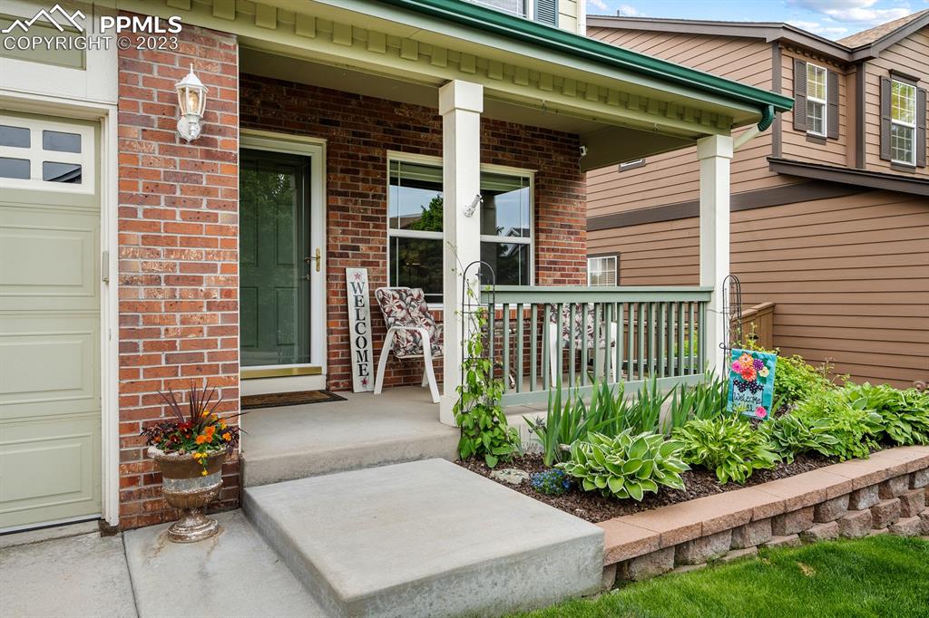 1104 Riddlewood Road Highlands Ranch, CO 80129 - Photo 2 of 19 a view of a house with porch and sitting area