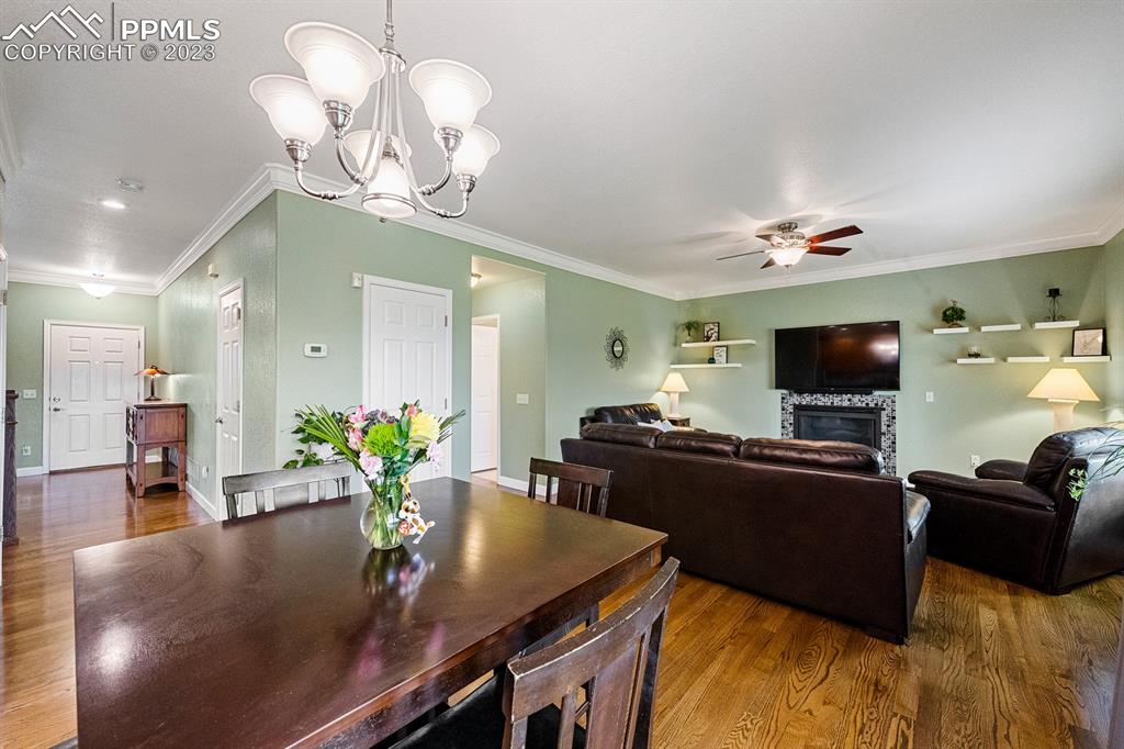 1104 Riddlewood Road Highlands Ranch, CO 80129 - Photo 5 of 19 a living room with furniture and a flat screen tv