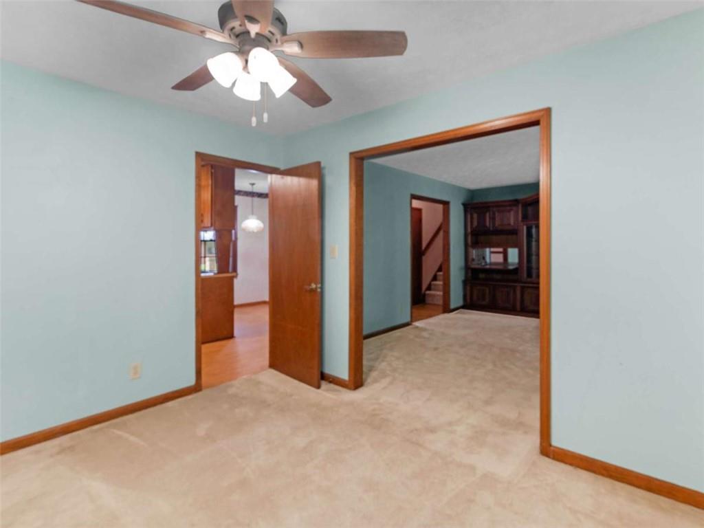 8294 Winston Way Jonesboro, GA 30236 - Photo 23 of 67 a view of a room with a ceiling fan and a bathroom