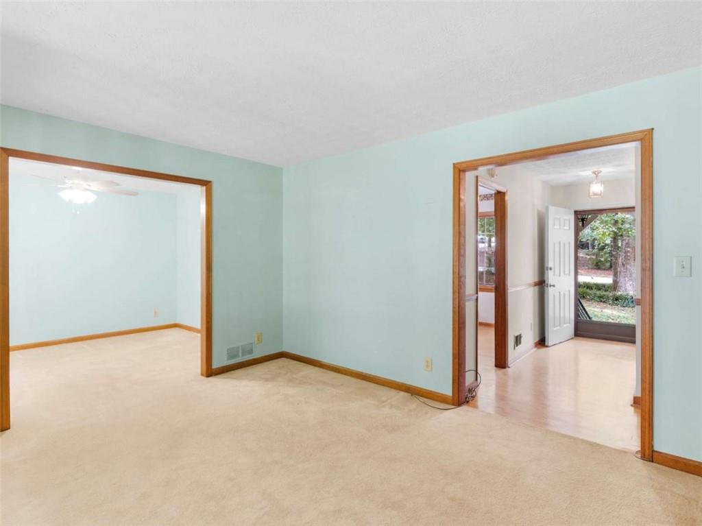 8294 Winston Way Jonesboro, GA 30236 - Photo 27 of 67 an empty room with sliding door and mirror