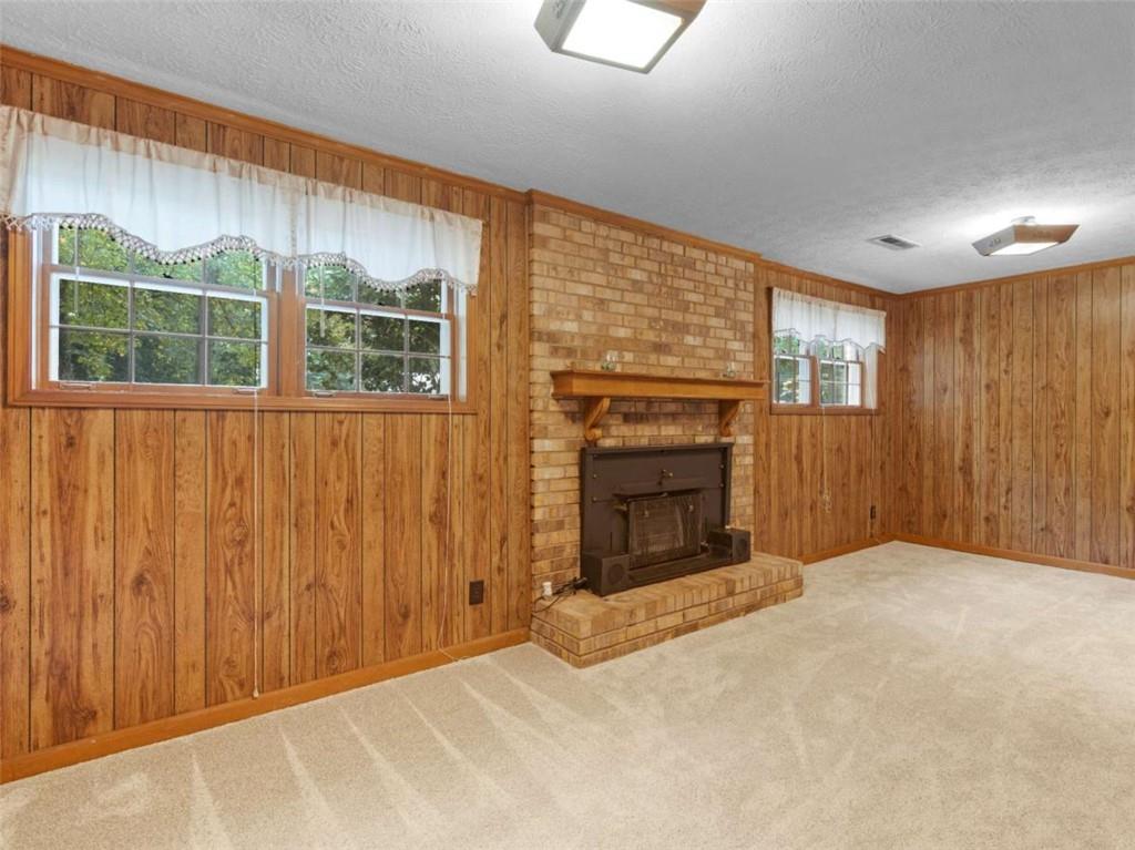 8294 Winston Way Jonesboro, GA 30236 - Photo 29 of 67 a view of an empty room with a fireplace and a window