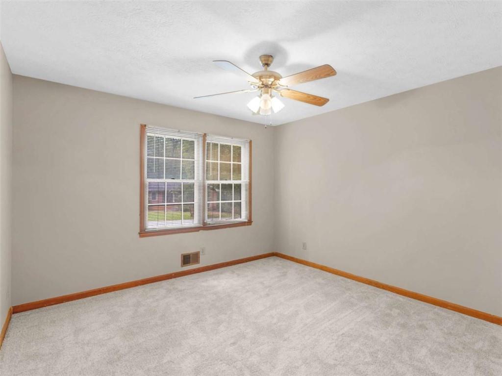 8294 Winston Way Jonesboro, GA 30236 - Photo 38 of 67 an empty room with a window and a fan
