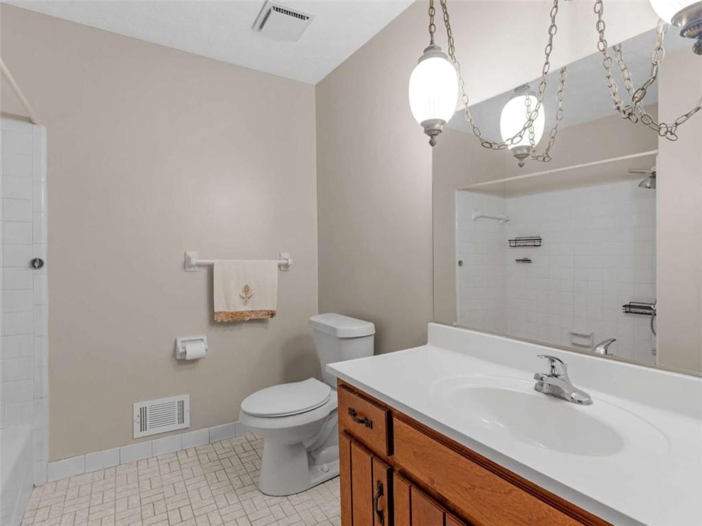 8294 Winston Way Jonesboro, GA 30236 - Photo 46 of 67 a bathroom with a sink a toilet and a mirror