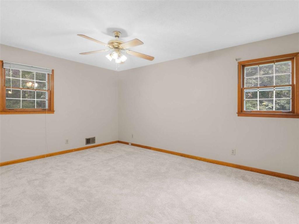 8294 Winston Way Jonesboro, GA 30236 - Photo 47 of 67 an empty room with windows and fan