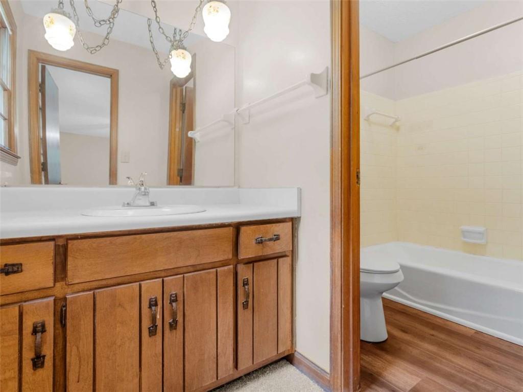 8294 Winston Way Jonesboro, GA 30236 - Photo 51 of 67 a bathroom with a granite countertop sink a toilet and a large mirror