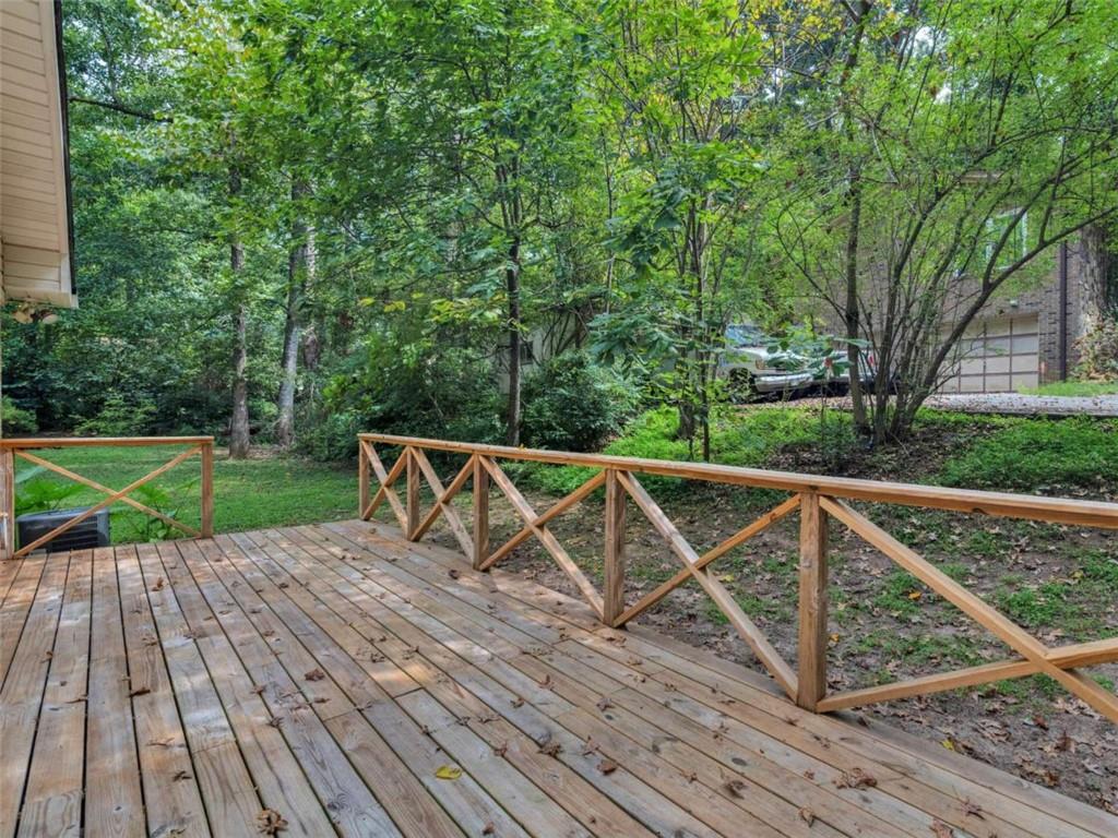 8294 Winston Way Jonesboro, GA 30236 - Photo 58 of 67 a wooden deck with trees in front of it