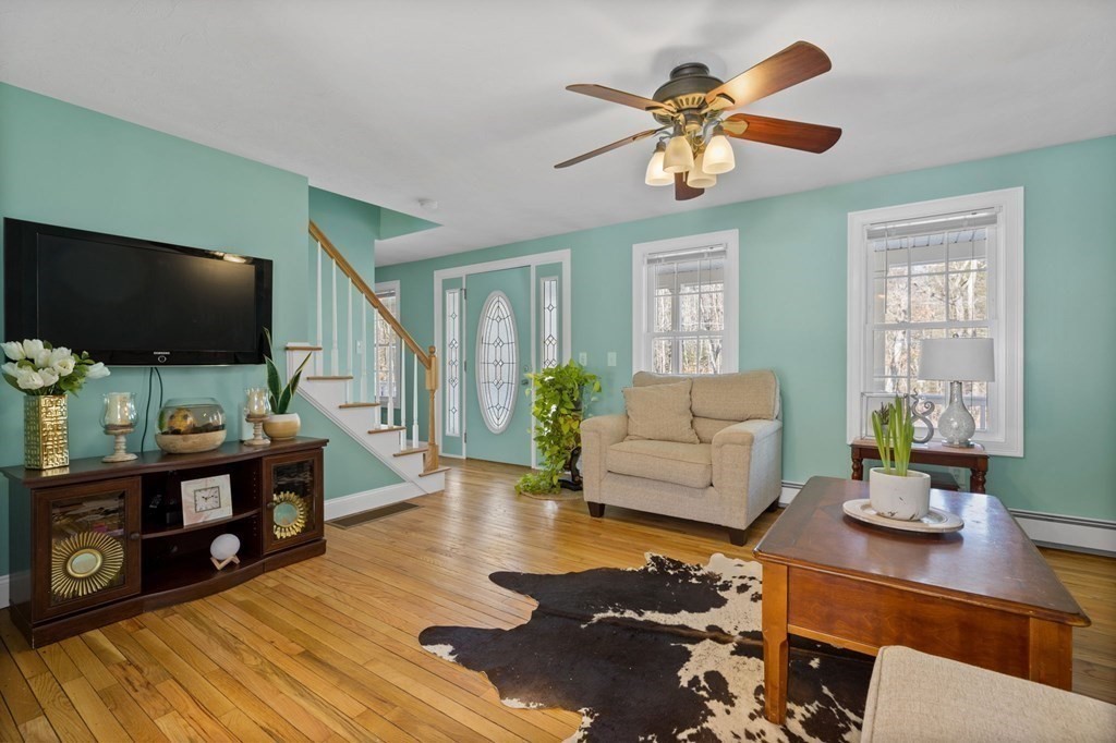 37 Lincoln Street Norton, MA 02766 - Photo 12 of 42 a living room with furniture and a flat screen tv