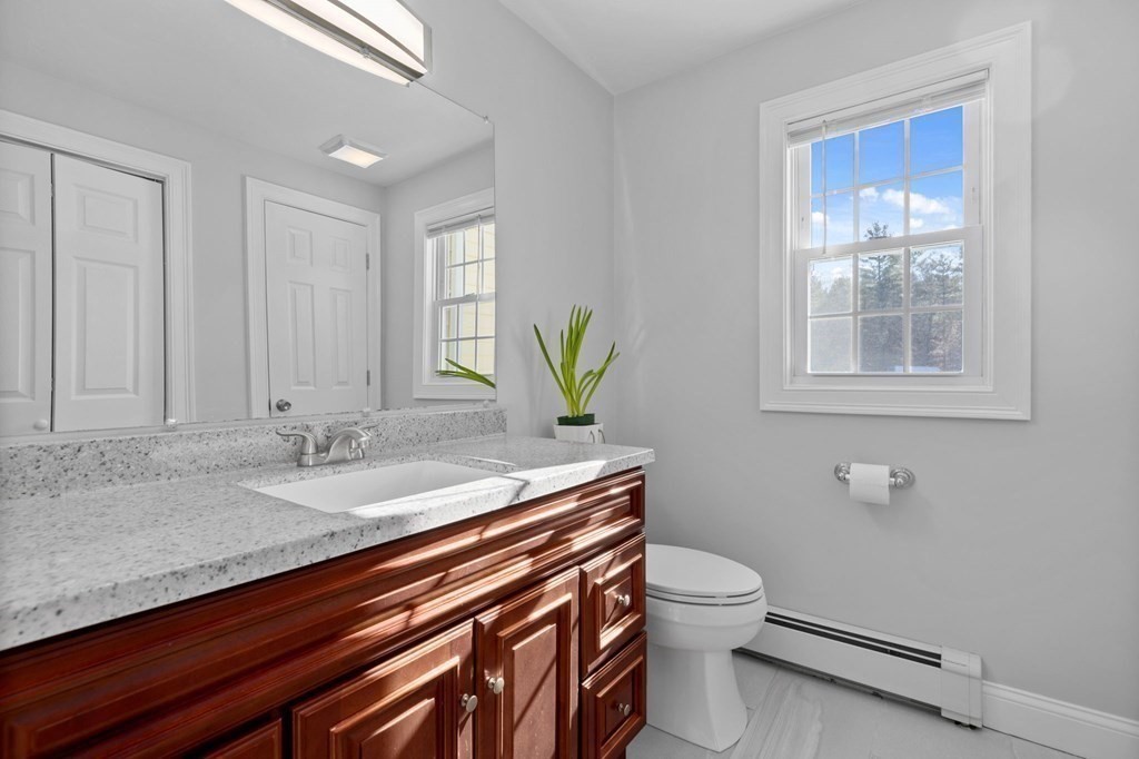 37 Lincoln Street Norton, MA 02766 - Photo 15 of 42 a bathroom with a granite countertop toilet sink and mirror