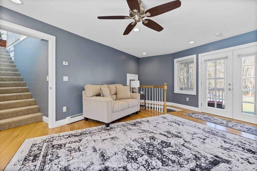 37 Lincoln Street Norton, MA 02766 - Photo 17 of 42 a bedroom with a bed and a large window with the outer view