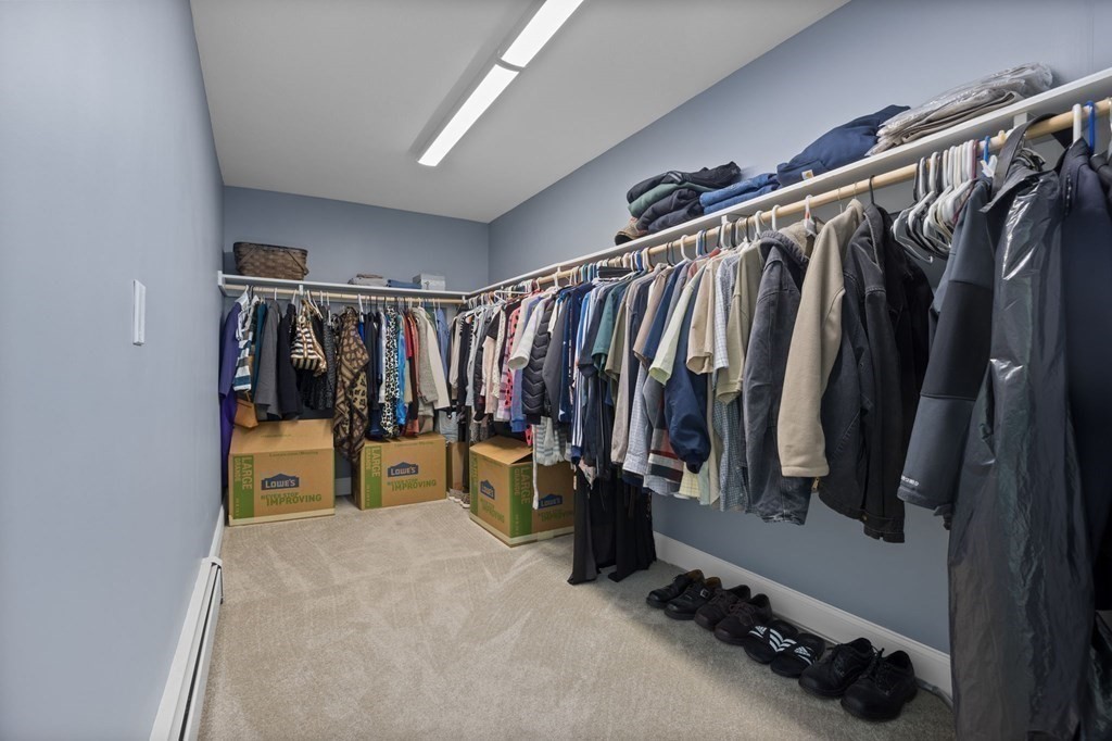 37 Lincoln Street Norton, MA 02766 - Photo 24 of 42 a view of walk in closet with clothes and shoes