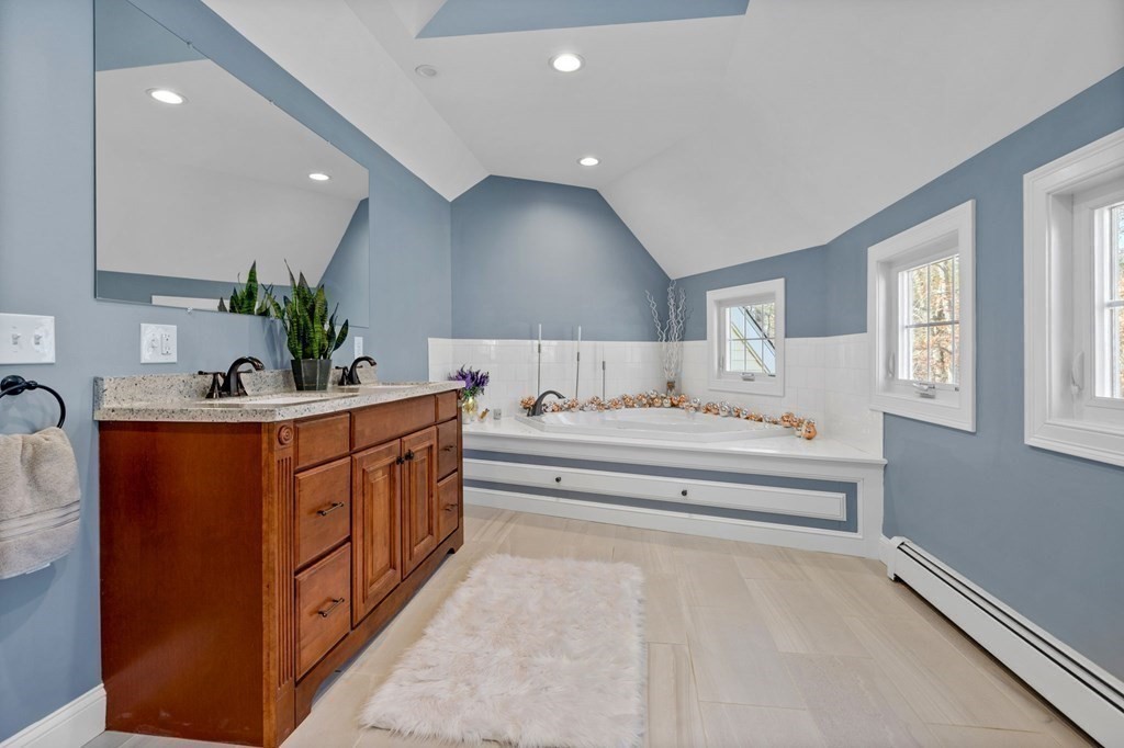 37 Lincoln Street Norton, MA 02766 - Photo 25 of 42 a bathroom with stainless steel appliances a sink cabinets and a window