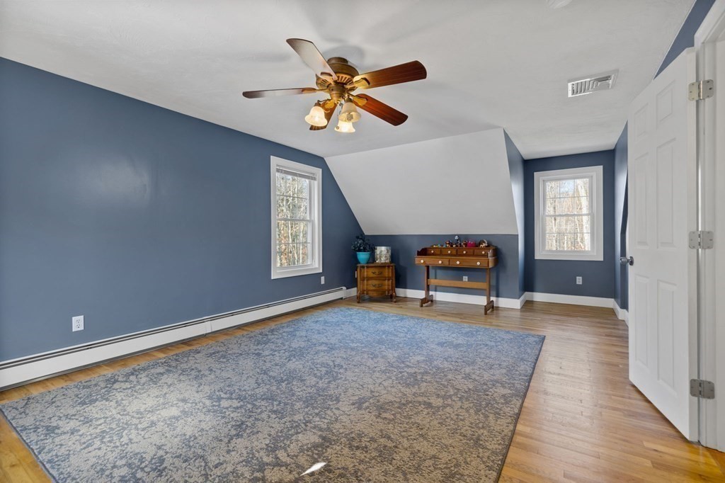 37 Lincoln Street Norton, MA 02766 - Photo 27 of 42 a living room with couch and a ceiling fan