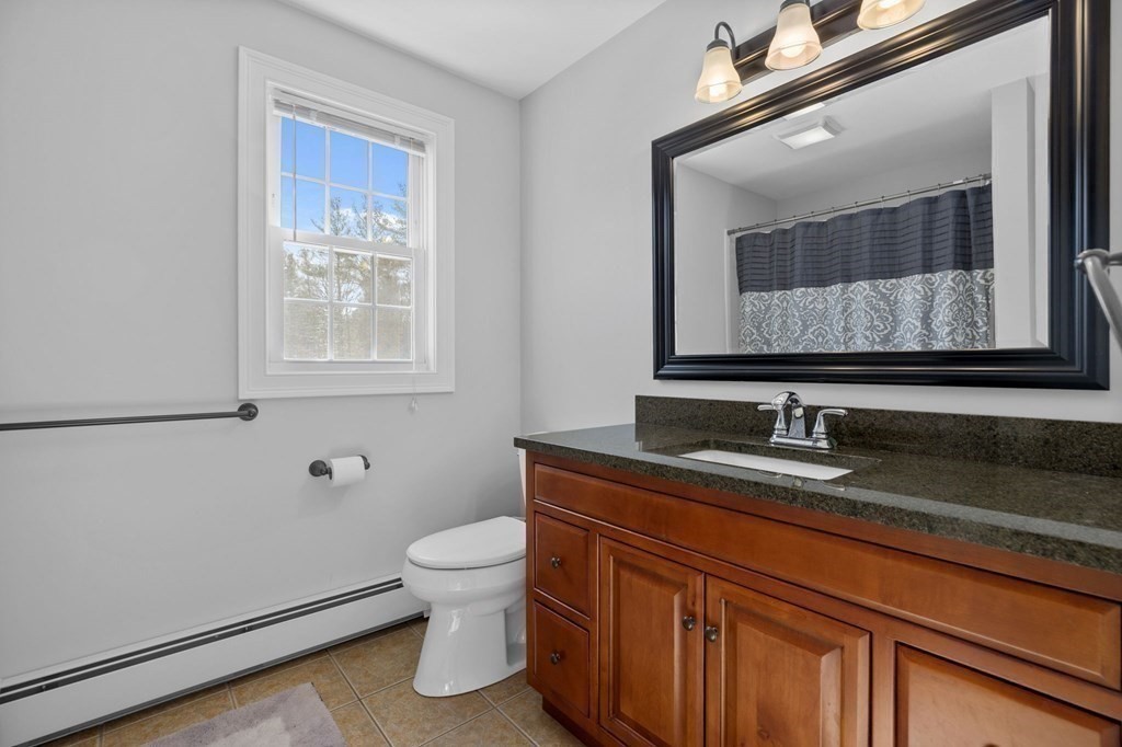 37 Lincoln Street Norton, MA 02766 - Photo 28 of 42 a bathroom with a toilet sink and mirror