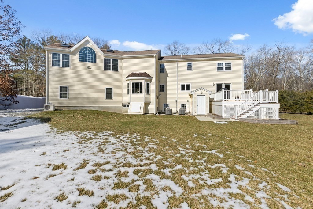 37 Lincoln Street Norton, MA 02766 - Photo 36 of 42 a view of white house with a big yard and large trees