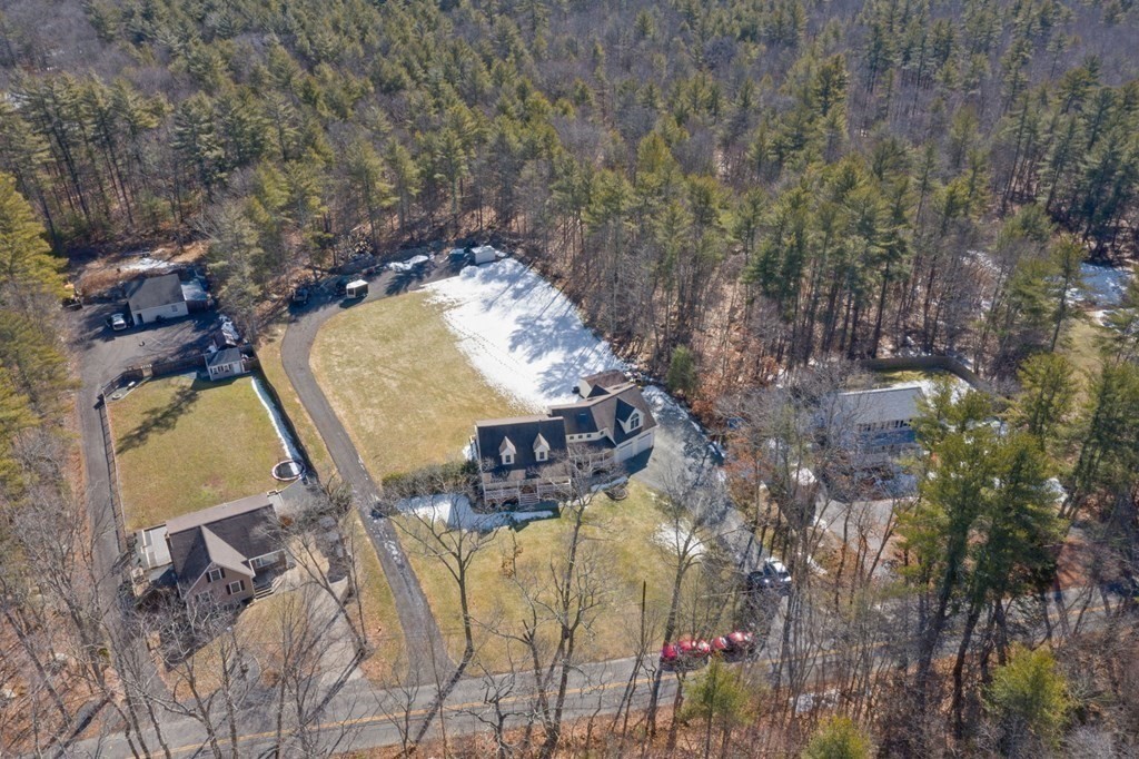 37 Lincoln Street Norton, MA 02766 - Photo 38 of 42 an aerial view of a house with a yard and large trees
