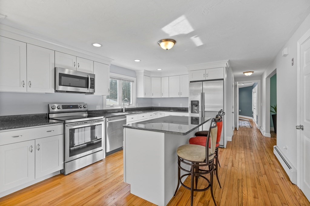 37 Lincoln Street Norton, MA 02766 - Photo 6 of 42 a kitchen with granite countertop a stove a sink and a refrigerator