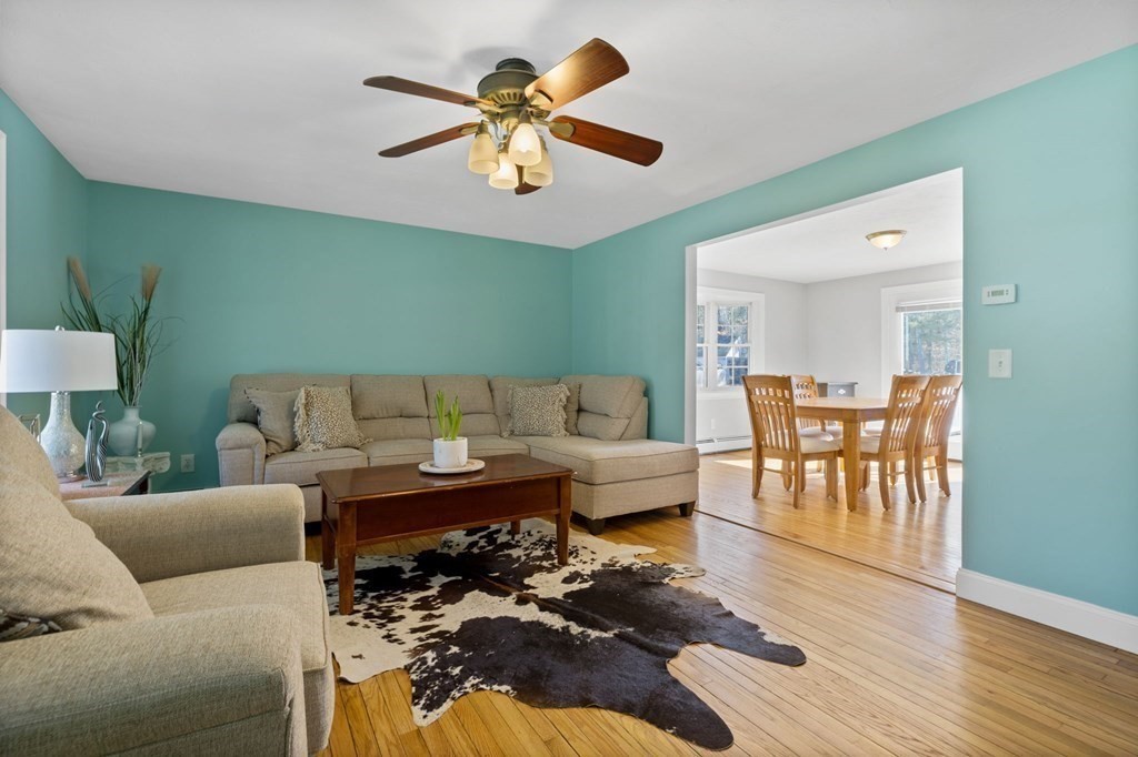 37 Lincoln Street Norton, MA 02766 - Photo 10 of 42 a living room with furniture wooden floor and a chandelier
