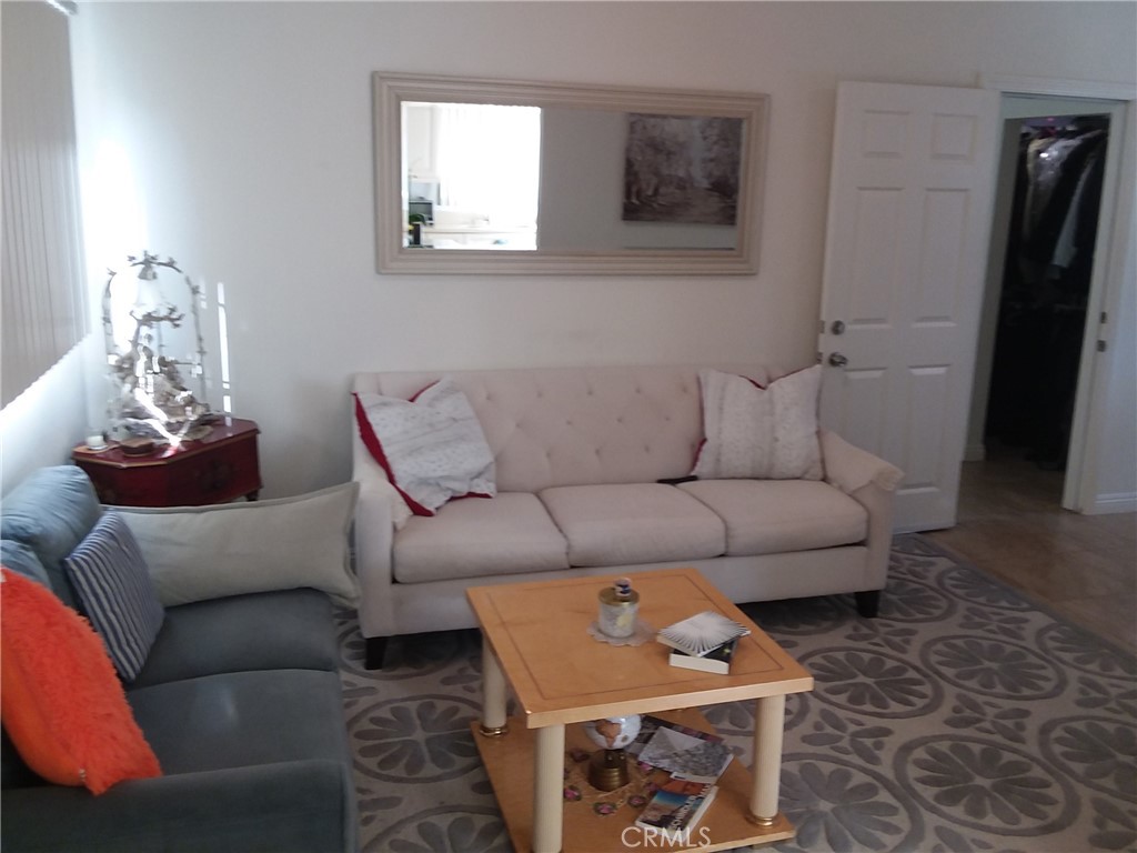 3810 West Heffron Drive, Unit B Burbank, CA 91505 - Photo 7 of 12 a living room with furniture and a window