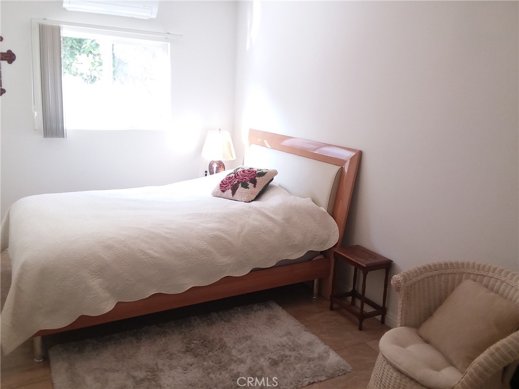 3810 West Heffron Drive, Unit B Burbank, CA 91505 - Photo 8 of 12 a bedroom with a bed and a couch