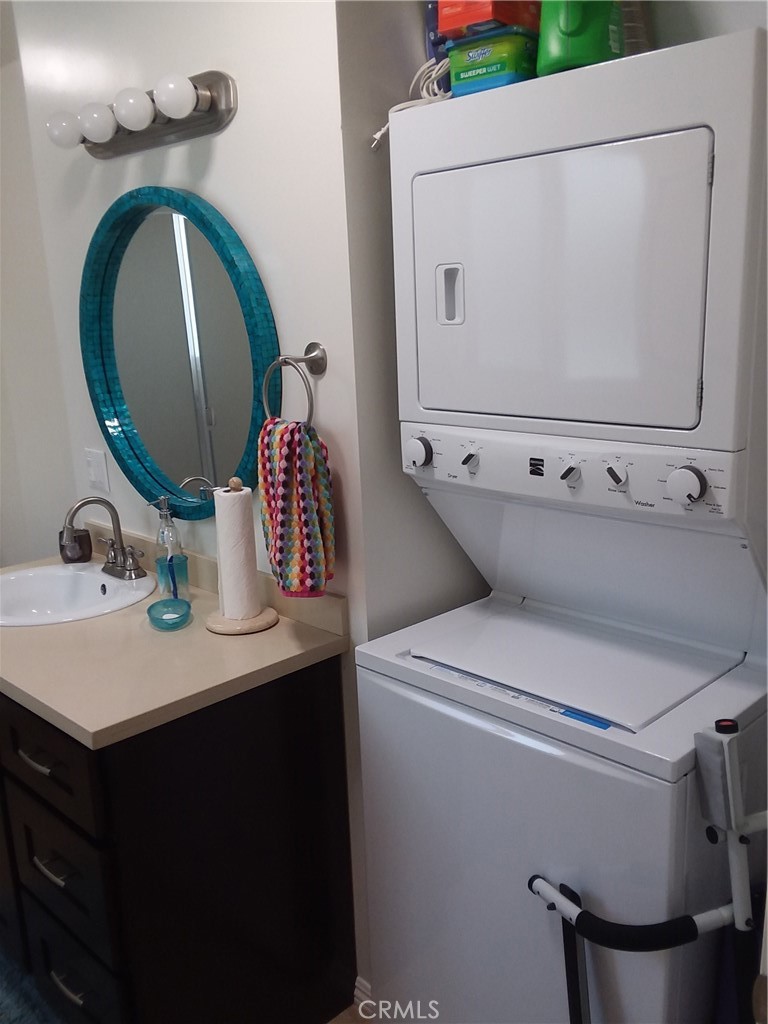 3810 West Heffron Drive, Unit B Burbank, CA 91505 - Photo 9 of 12 a bathroom with a sink mirror vanity and toilet