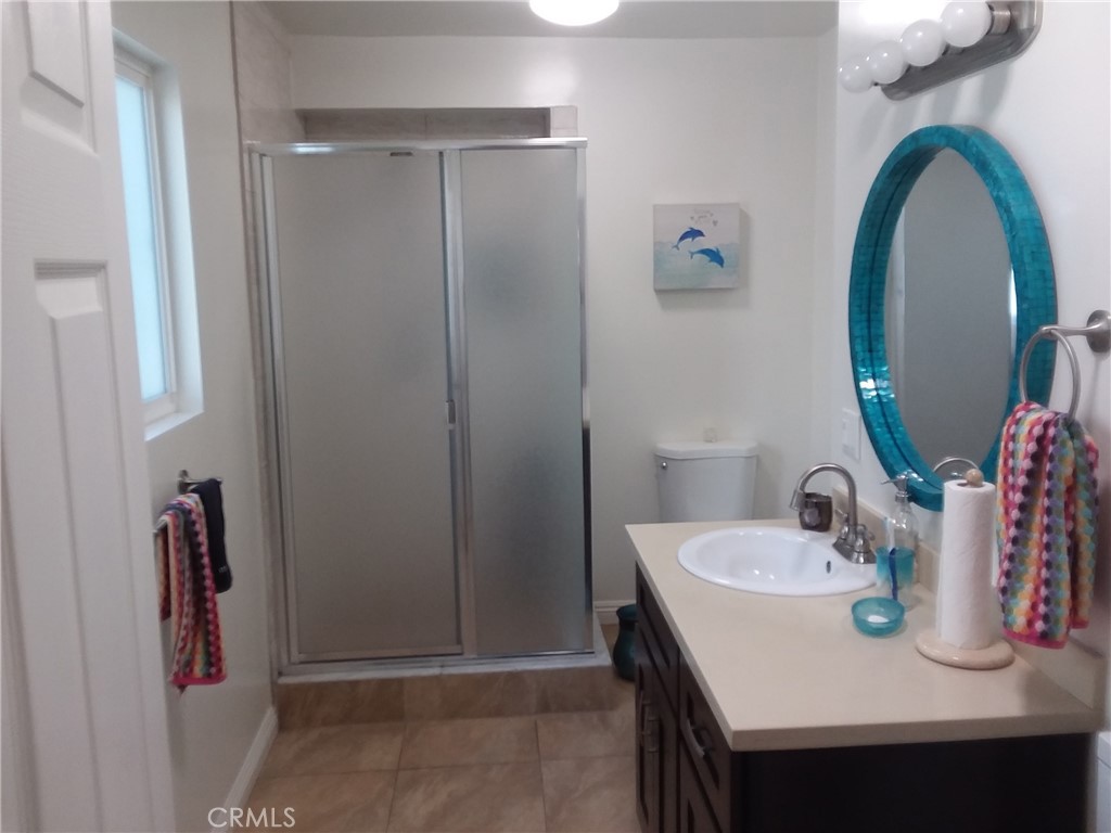 3810 West Heffron Drive, Unit B Burbank, CA 91505 - Photo 10 of 12 a bathroom with a sink and a mirror