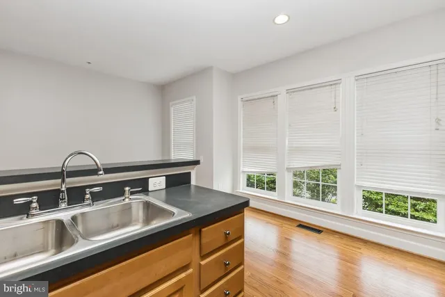 a bathroom with a sink and a large window