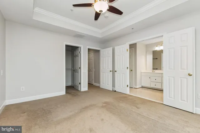 a view of empty room with ceiling fan