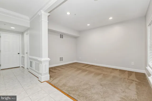 an empty room with white walls and white walls