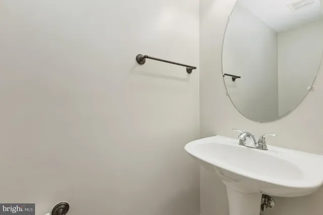 a bathroom with a sink and mirror