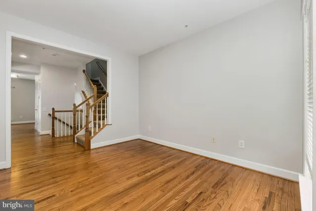 a view of an entryway with wooden floor