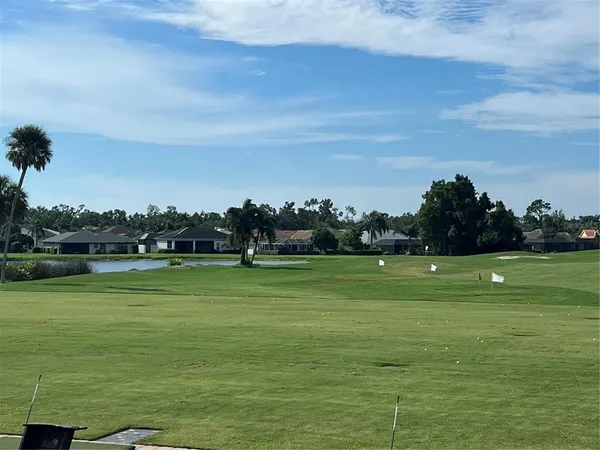 a view of a golf course with a lake