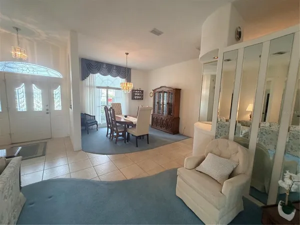 a view of a livingroom with furniture and a large window