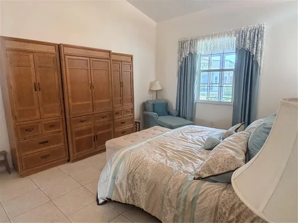 a bedroom with a bed and a closet