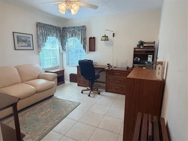 a workspace with furniture and a window