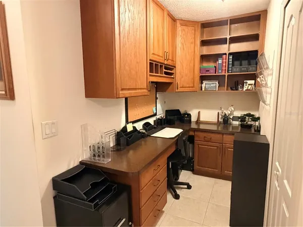 a kitchen with stainless steel appliances a stove a sink and cabinets