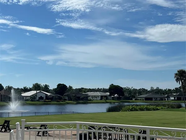 a view of a lake with a big yard